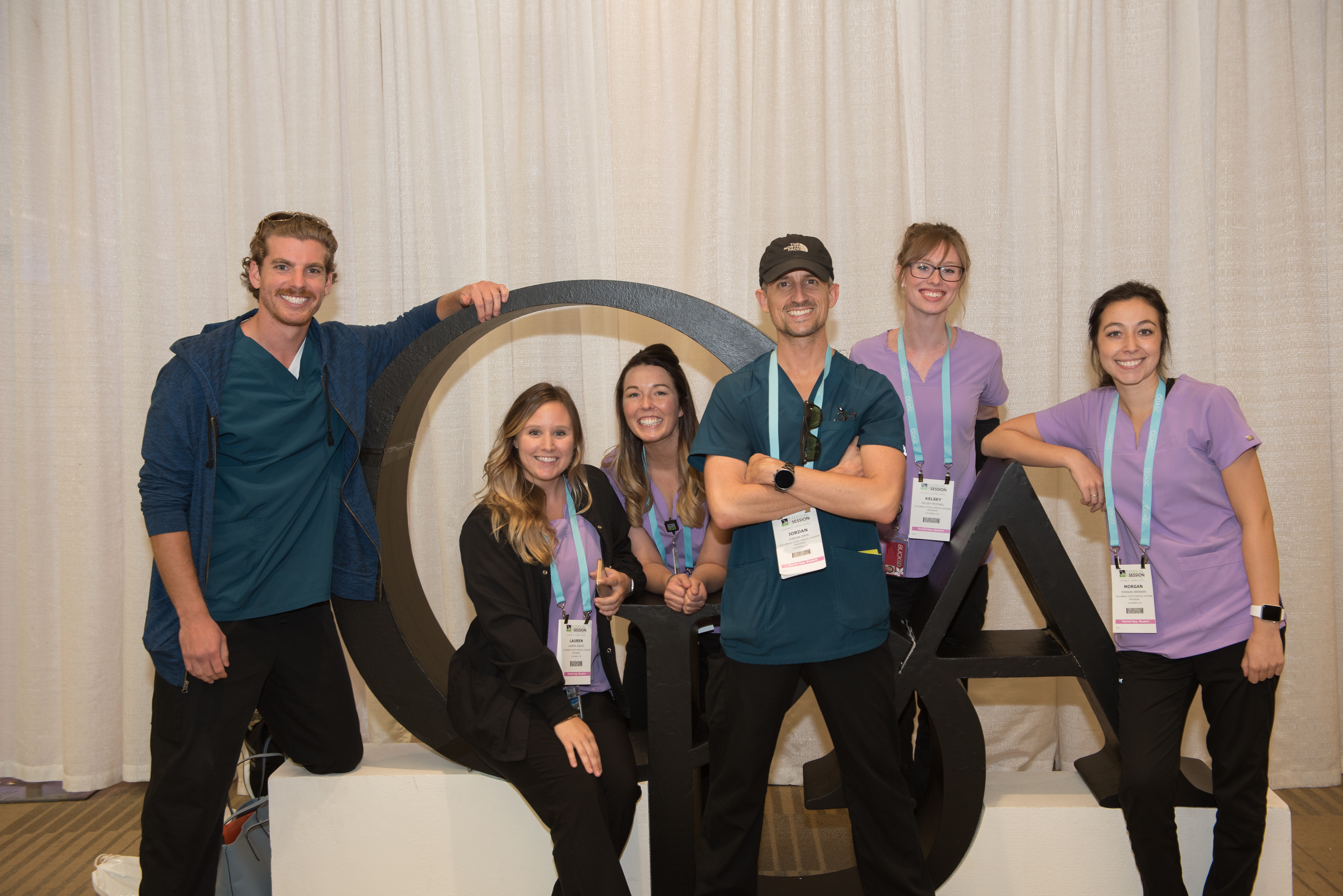 group in front of ODA letters