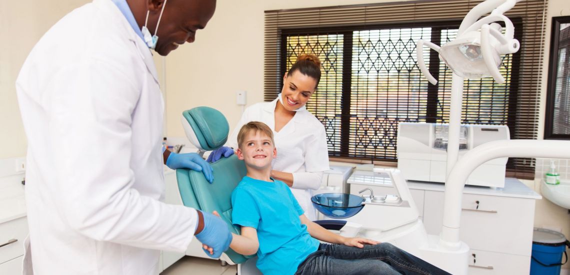 Dentist with boy patient